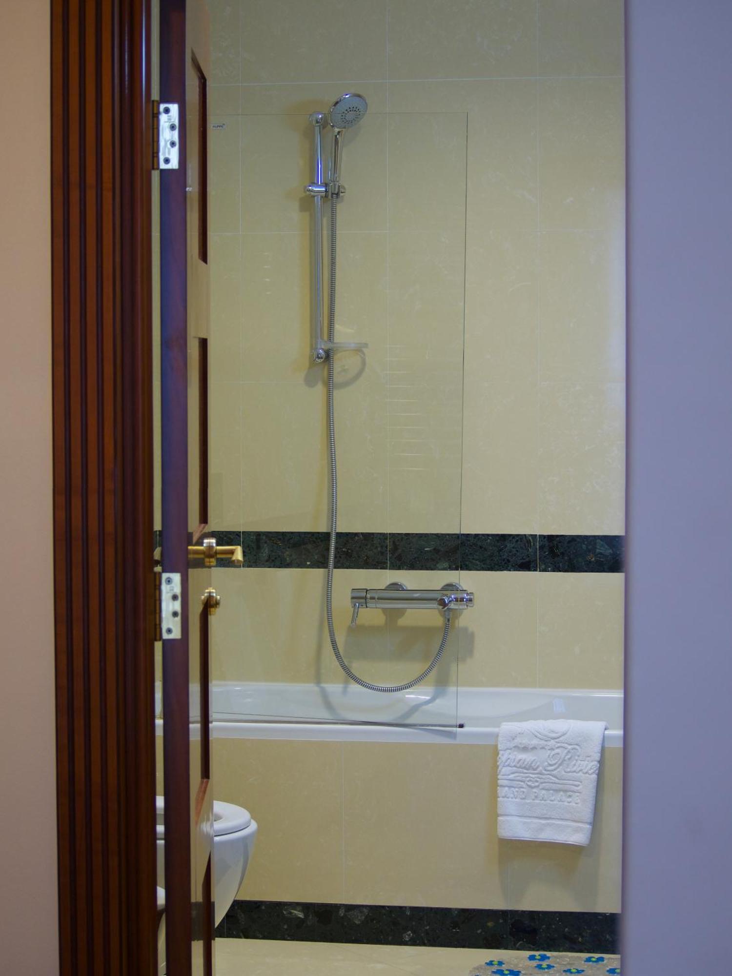 Caspian Riviera Grand Palace Hotel Aktau  Exterior photo A shower with a thermostatic valve