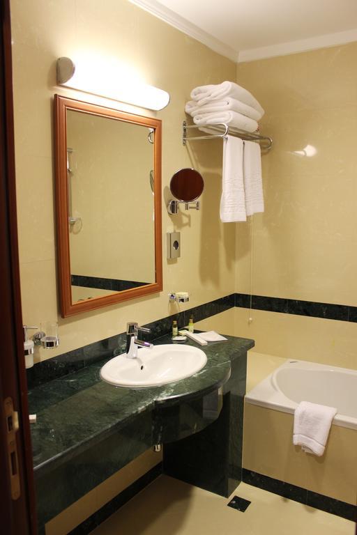 Caspian Riviera Grand Palace Hotel Aktau  Exterior photo A bathroom in a hotel
